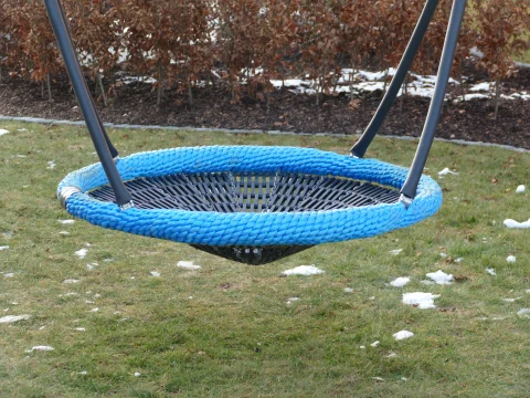 Blue nest swing on a playground